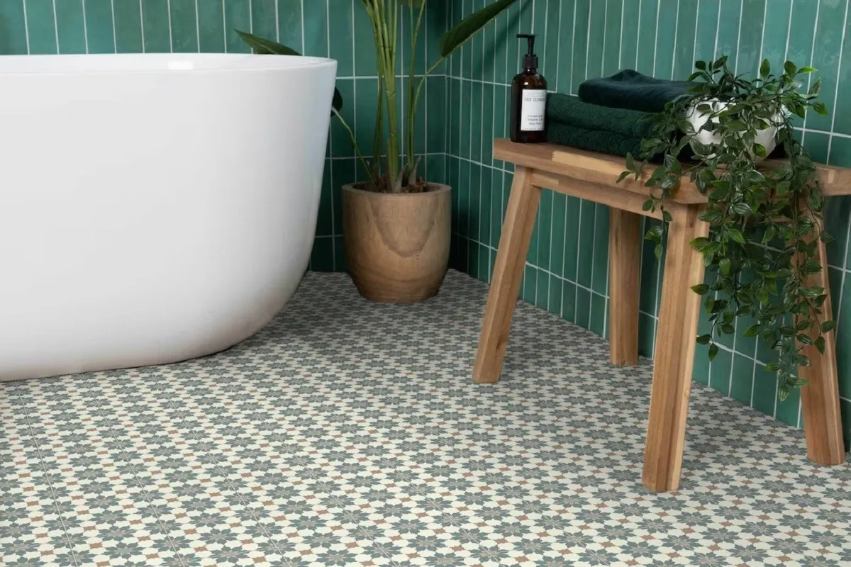 A green and white linoleum flooring in a bathroom.