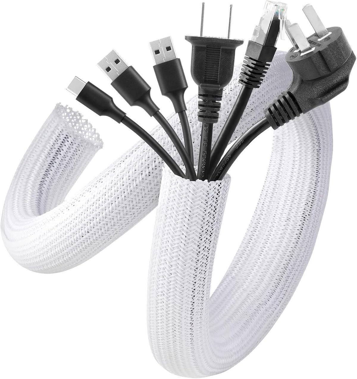 Many computer cords tucked into a white cord keeper.