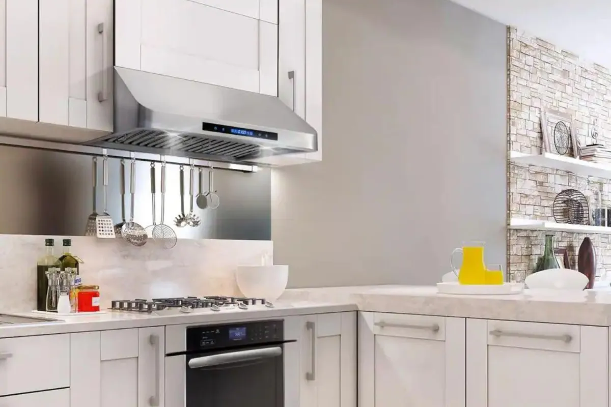 Contemporary kitchen with white cabinets and black and stainless steel appliances.