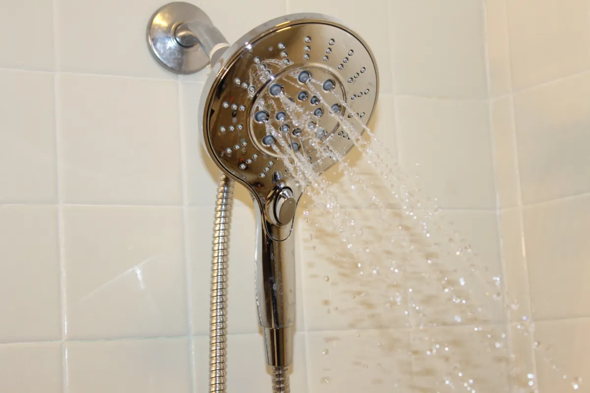 Moen Engage shower head with water on