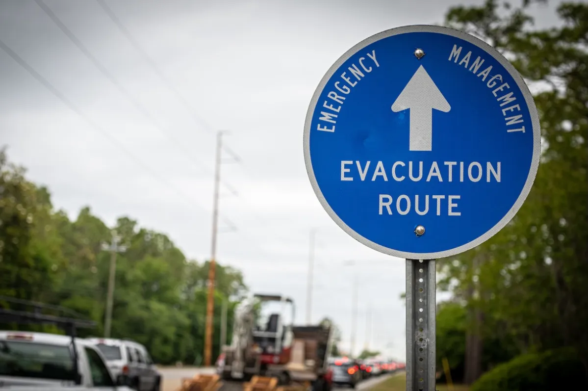 Hurricane evacuation sign on a street.