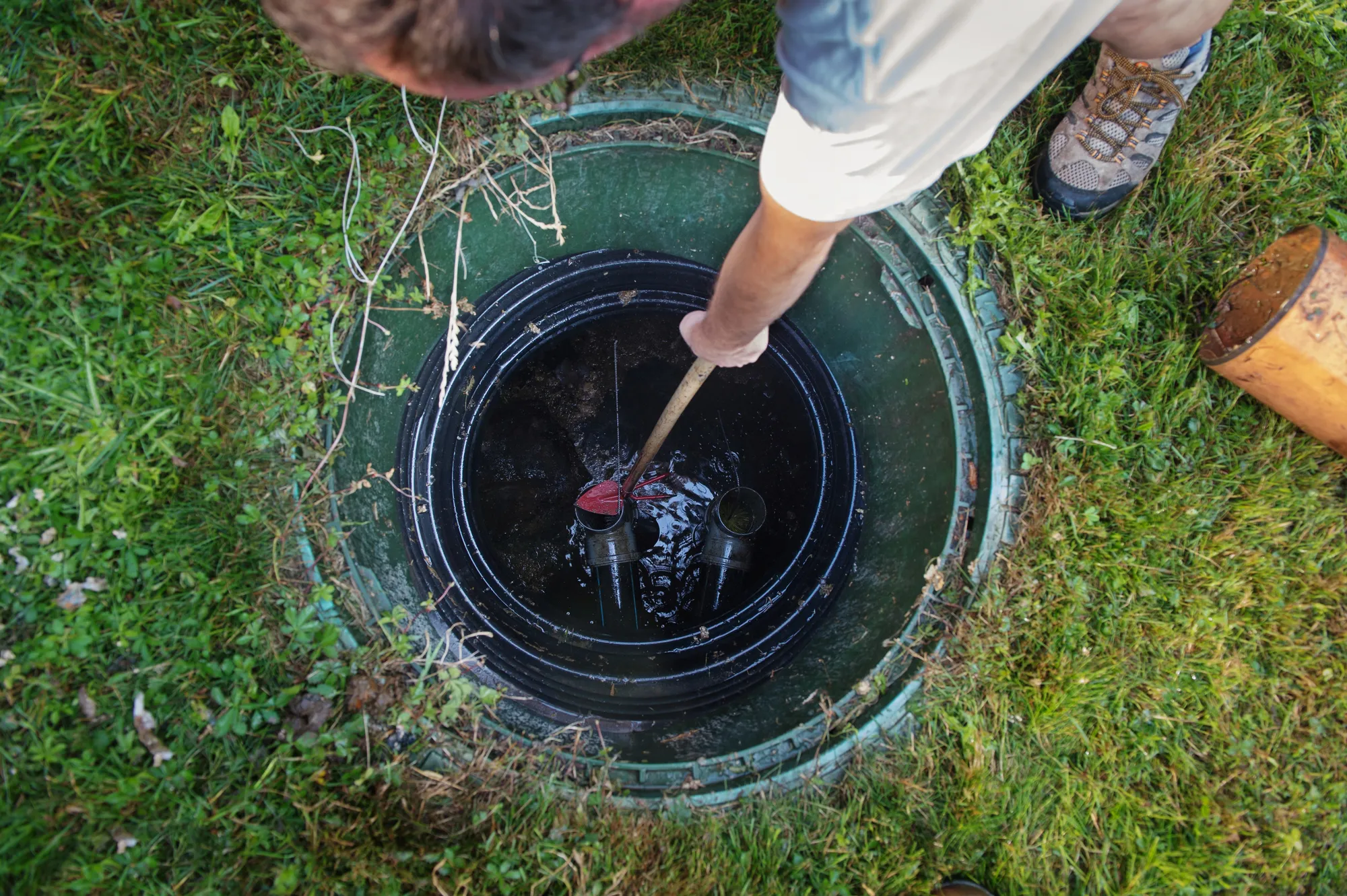Cleaning and unblocking septic system. View from above.