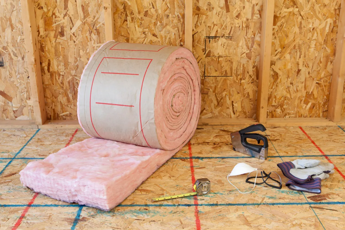 Rolled fiberglass insulation with tools