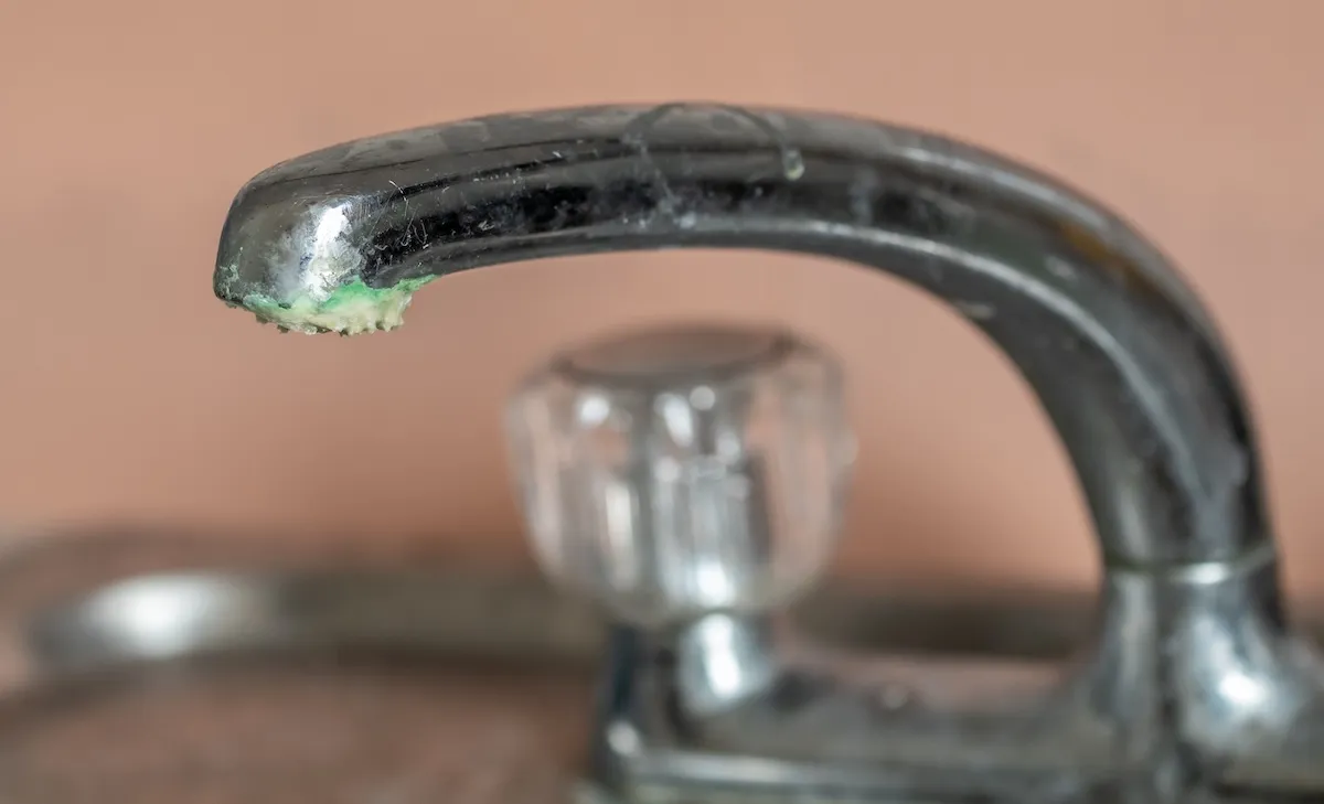 Acidic corrosion on a sink faucet.