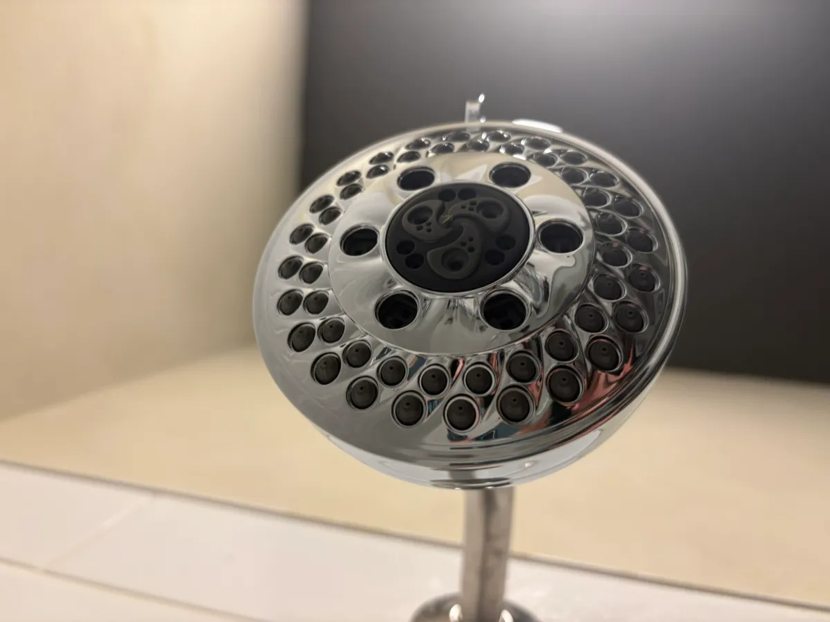 Delta H2kinetic 5-Setting Shower Head in the bathroom as an example of the best shower head for low pressure