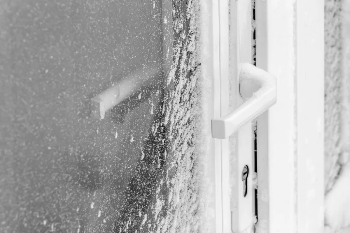 A front door covered in a thick layer of ice.